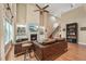 Open-concept living room featuring a fireplace, hardwood floors, and staircase at 1009 Blue Larkspur Ave, Wake Forest, NC 27587