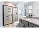 Bathroom featuring a glass-enclosed shower and granite vanity at 1030 Steinbeck Dr, Durham, NC 27703