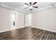 Tranquil bedroom showcases wood flooring, neutral walls, and access to en-suite bath at 1030 Steinbeck Dr, Durham, NC 27703