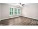 A sunlit bedroom features lovely floors, crown molding, neutral walls, and plantation shutters at 1030 Steinbeck Dr, Durham, NC 27703
