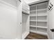 Walk-in closet with built-in shelving and hanging rods at 1030 Steinbeck Dr, Durham, NC 27703