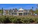 Exterior view of CreekSide clubhouse with meticulous landscaping and a welcoming entrance at 1030 Steinbeck Dr, Durham, NC 27703