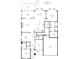 First floorplan featuring a kitchen, primary bedroom, living spaces, and a garage at 1030 Steinbeck Dr, Durham, NC 27703