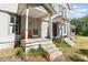 Charming two-story home with weathered porch and multiple entrances at 110 E Church St, Creedmoor, NC 27522