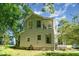 View of home's side with unique window configuration at 110 E Church St, Creedmoor, NC 27522