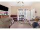 A cozy living room featuring a crib, changing table, and play area for young children at 110 E Church St, Creedmoor, NC 27522
