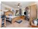 Large bedroom with a king bed, ceiling fan and plenty of storage at 110 E Church St, Creedmoor, NC 27522
