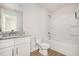 Well-lit full bathroom offers modern fixtures, a vanity, and a bathtub shower at 110 Hays St, Oxford, NC 27565