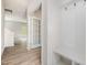 Inviting entryway with coat hooks, seating and view to living space with glass paneled french doors at 110 Hays St, Oxford, NC 27565