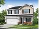 Charming two-story home with a two-car garage, black shutters, and a well-manicured lawn at 110 Hays St, Oxford, NC 27565