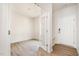 Bright entryway features wood-look floors, a convenient bench, and an open doorway to another room at 112 Hays St, Oxford, NC 27565