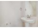 Powder room featuring pedestal sink, mirror, and modern fixtures at 114 Hays St, Oxford, NC 27565