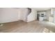 Open-concept living room showcasing the staircase and stylish kitchen with stainless appliances at 114 Hays St, Oxford, NC 27565