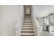 Elegant staircase with wood treads and white risers leads to the upper level at 114 Hays St, Oxford, NC 27565