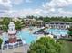 Aerial view of Amberly's community pool featuring a water park, slide, and plenty of seating at 1206 Chalk Maple Dr, Cary, NC 27519