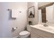 Cozy bathroom featuring a unique sloth art piece, marble vanity, and tile shower at 1206 Chalk Maple Dr, Cary, NC 27519
