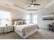 Comfortable bedroom with neutral decor, carpet, and plenty of natural light at 1206 Chalk Maple Dr, Cary, NC 27519