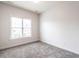 Bright bedroom with plush carpeting and a large window for natural light at 1206 Chalk Maple Dr, Cary, NC 27519