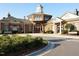 Clubhouse exterior with brick facade, well-manicured bushes, and sidewalks at 1206 Chalk Maple Dr, Cary, NC 27519