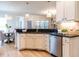 Bright kitchen with granite countertops, stainless steel appliances, and modern lighting at 1206 Chalk Maple Dr, Cary, NC 27519
