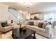 Open living room with hardwood floors, a neutral palette, and an open kitchen at 1206 Chalk Maple Dr, Cary, NC 27519