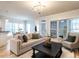 Inviting living room with hardwood floors, modern decor, and lots of natural light at 1206 Chalk Maple Dr, Cary, NC 27519