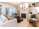 Comfortable living room showcasing a fireplace, built-in shelves and natural light at 1206 Chalk Maple Dr, Cary, NC 27519