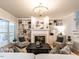Cozy living room featuring built-in bookshelves, a fireplace, and comfortable seating at 1206 Chalk Maple Dr, Cary, NC 27519