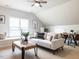 Stylish living room with vaulted ceiling, comfortable seating, and a window seat at 1206 Chalk Maple Dr, Cary, NC 27519