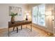 Bright office featuring a wooden desk, a modern rug, and natural light at 1206 Chalk Maple Dr, Cary, NC 27519