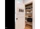 Organized pantry with shelving for storage and door organizers at 1206 Chalk Maple Dr, Cary, NC 27519