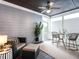 Relaxing screened porch with comfortable seating, ceiling fan, and outdoor view at 1206 Chalk Maple Dr, Cary, NC 27519