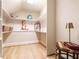 Spacious walk-in closet with custom shelving, ample storage and hardwood floors at 1206 Chalk Maple Dr, Cary, NC 27519