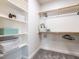 Organized walk-in closet with shelving, hanging rods, and ample storage space at 1206 Chalk Maple Dr, Cary, NC 27519