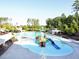 Amberly water park featuring a blue slide, splashpad, playground, and seating area at 1206 Chalk Maple Dr, Cary, NC 27519