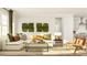 Cozy living room featuring a comfortable sofa, a modern coffee table, and natural light through a window at 1224 Coral Cay Bnd, Wake Forest, NC 27587