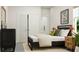 Comfortable bedroom with stylish decor, natural light from a large window, and ample closet space at 1232 Coral Cay Bnd, Wake Forest, NC 27587