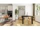 Open dining area with a dark wood table, seating for six, and natural light at 1232 Coral Cay Bnd, Wake Forest, NC 27587
