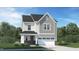 Charming two-story home featuring a two-car garage, stone accents, and covered entryway at 1232 Coral Cay Bnd, Wake Forest, NC 27587