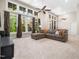 Finished basement features a large sectional couch and windows with outdoor views at 12424 Beauvoir St, Raleigh, NC 27614