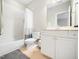 Bathroom featuring a tub-shower combo, toilet and vanity with mirror at 12424 Beauvoir St, Raleigh, NC 27614