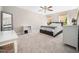 Bedroom with neutral carpet and paint, modern gray bed frame, and natural light at 12424 Beauvoir St, Raleigh, NC 27614