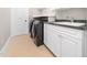 Laundry room with modern washer and dryer and ample counter space at 12424 Beauvoir St, Raleigh, NC 27614