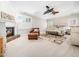 Spacious main bedroom featuring a fireplace, sitting area, and mounted television at 12424 Beauvoir St, Raleigh, NC 27614