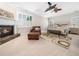 Bright main bedroom boasting a fireplace, cozy seating, and neutral decor at 12424 Beauvoir St, Raleigh, NC 27614