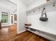 Clean mud room with shoe storage and hooks, perfect for staying organized at 12424 Beauvoir St, Raleigh, NC 27614