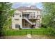 The rear of the house features a deck, patio, walkout basement, and fenced yard at 12424 Beauvoir St, Raleigh, NC 27614