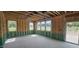 Open-concept living room with multiple windows and stud framing, ready for customization at 127 Caspian Ct, Lillington, NC 27546