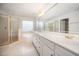 Bright bathroom featuring a double vanity, bathtub and glass enclosed shower at 1401 Brewer Jackson Ct, Wake Forest, NC 27587