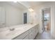 Bathroom featuring a long double vanity with an expansive mirror and lighting at 1401 Brewer Jackson Ct, Wake Forest, NC 27587